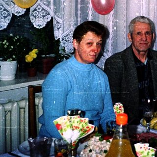 Family celebration with birthday decorations and food.