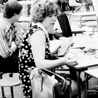 People dining outdoors at a casual restaurant.