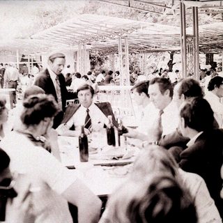 Business lunch or conference in a large indoor venue.