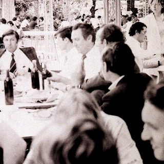 Business lunch or conference in a large indoor venue.