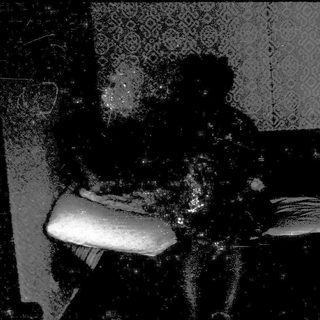 Blurred close-up of person holding a phone.