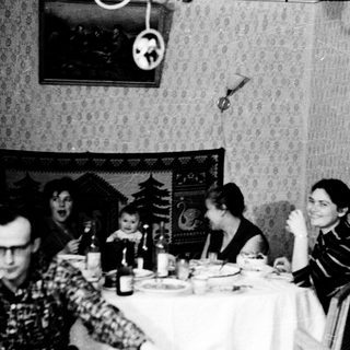Family gathering at festive holiday table.