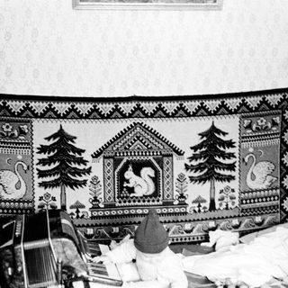 Vintage quilt with forest and animal designs.