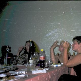 People enjoying a water-filled indoor party.