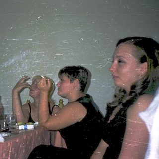 People enjoying a water-filled indoor party.