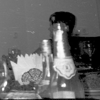 Celebratory gathering with people drinking champagne indoors.