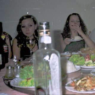 People dining together at a restaurant table.