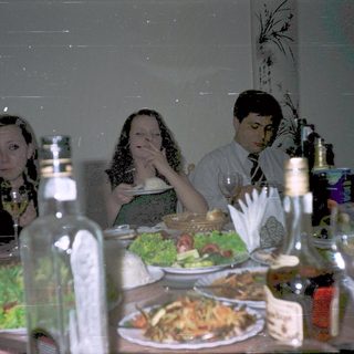 People dining together at a restaurant table.