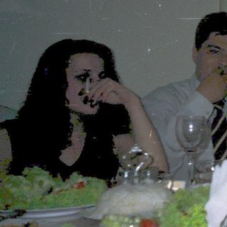 Group dining together at a formal table.