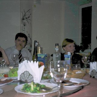 Group dining together at a formal table.