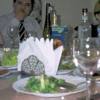 Group dining together at a formal table.