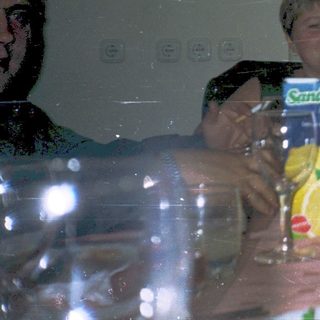 Group enjoying meal and drinks indoors.