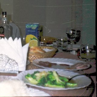 Celebratory meal with two people at a festive table.