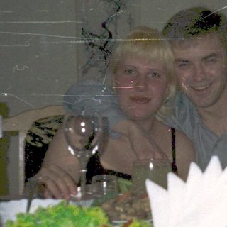 Celebratory meal with two people at a festive table.