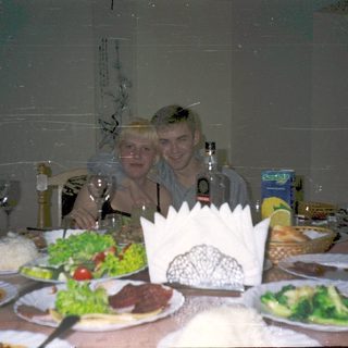 Celebratory meal with two people at a festive table.