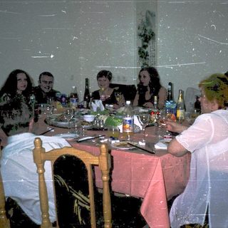 Group gathered for a formal dinner party.