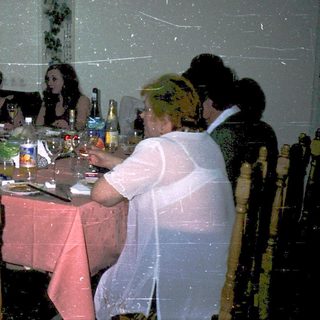 Group gathered for a formal dinner party.