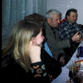 Family gathering celebrating 45th birthday with food and drinks.