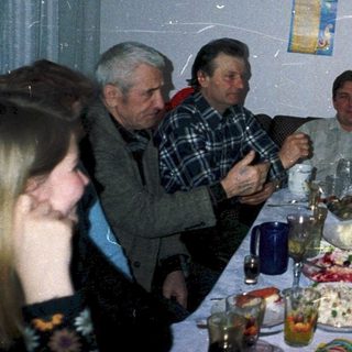 Family gathering celebrating 45th birthday with food and drinks.