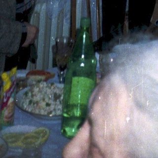 Celebratory birthday party with older guests indoors.