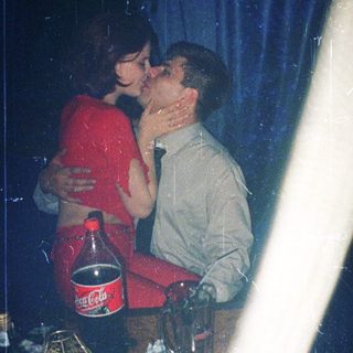 Two people sharing an intimate moment indoors.