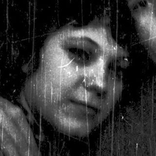 Two people standing under a shower.
