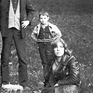 Family portrait outdoors in vintage style.