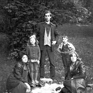 Family portrait outdoors in vintage style.