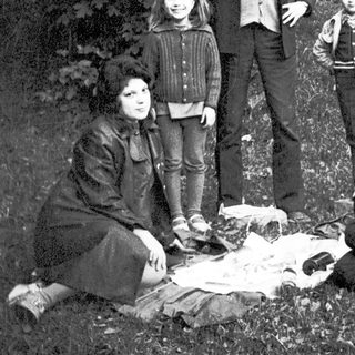 Family portrait outdoors in vintage style.