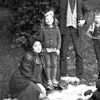 Family portrait outdoors in vintage style.