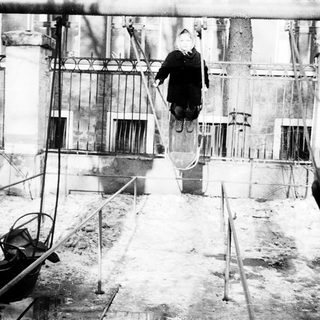 Worker suspended in industrial construction site.