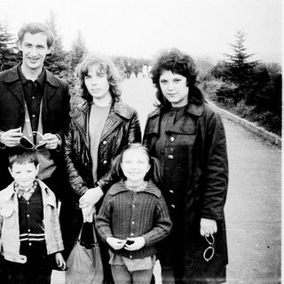 Family portrait outdoors in winter attire.