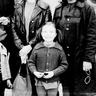 Family portrait outdoors in winter attire.