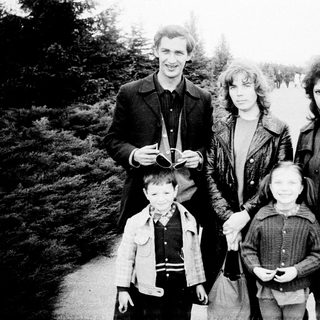 Family portrait outdoors in winter attire.