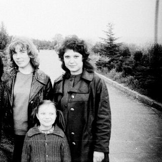 Family portrait outdoors in vintage style.