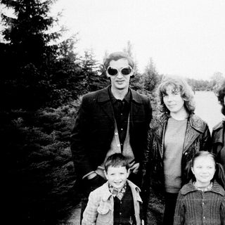 Family portrait outdoors in vintage style.