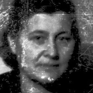 Two elderly women posing indoors, likely from mid-20th century.