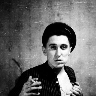 Vintage portrait of a man in early 20th-century attire.