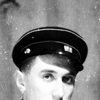 Young man in vintage naval officer uniform.