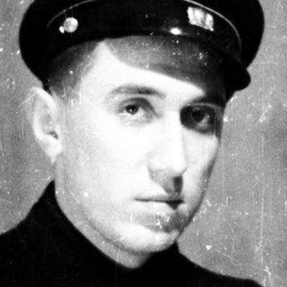 Young man in vintage naval officer uniform.
