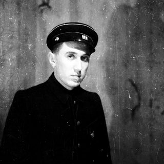 Young man in vintage naval officer uniform.