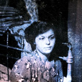 Vintage photograph of a person indoors.