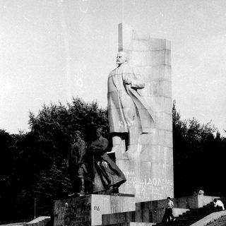 Monument depicting Stalin with smaller figures.