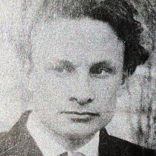 Portrait of a man in formal attire, mid-20th century.