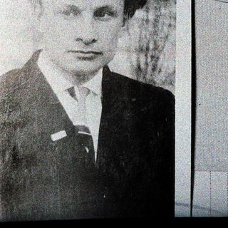 Portrait of a man in formal attire, mid-20th century.