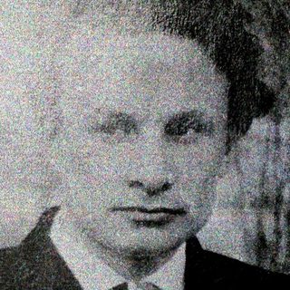 Portrait of a man in formal attire.