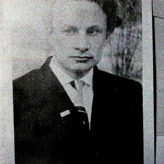 Portrait of a man in formal attire.
