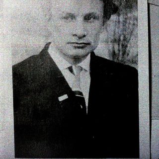 Portrait of a man in formal attire.