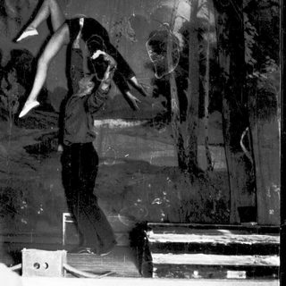 Skater performing trick on ledge.