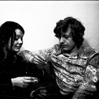 Two people playing a card game.